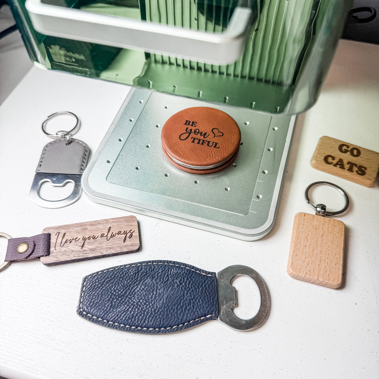 Custom laser engraved leather keychains and wooden bottle openers engraved on site for events in Louisville, Kentucky.