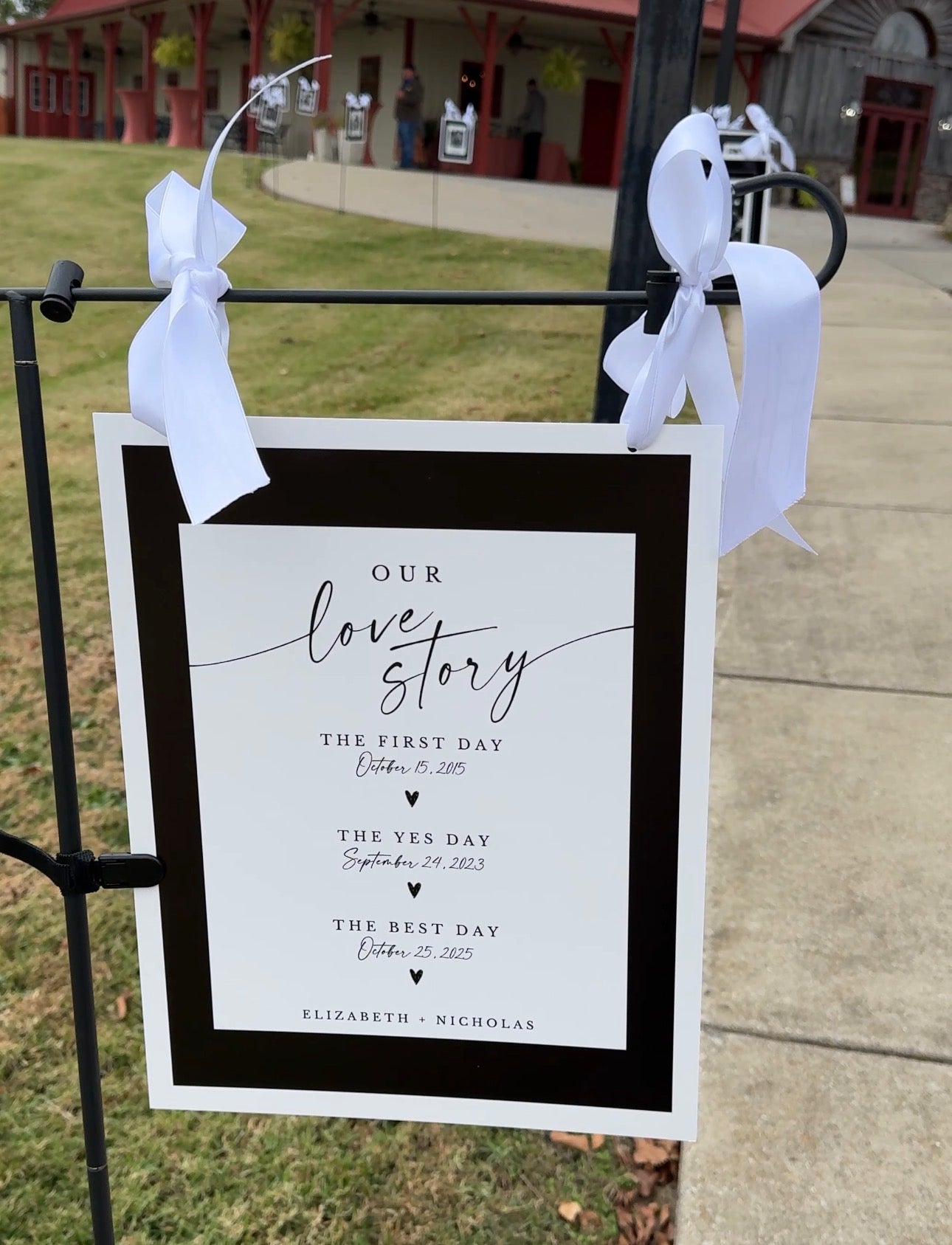 Custom wedding love story sign displayed at an outdoor event in Louisville, Kentucky, personalized for a couple’s wedding.